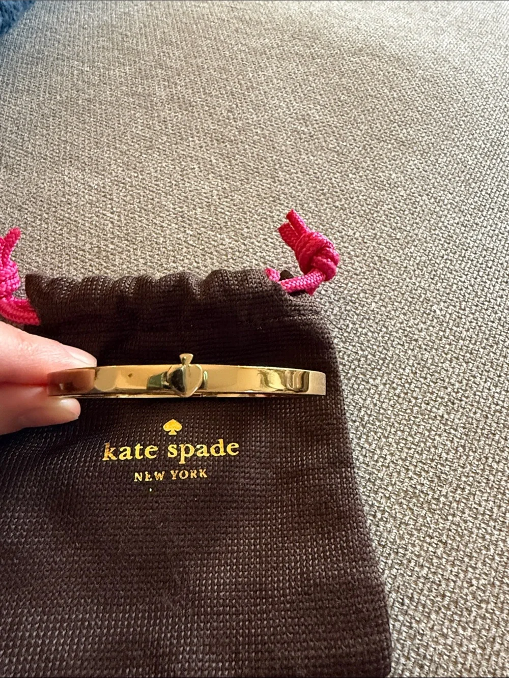 kate spade gold bangle with brown pouch and pink drawstrings - Picture 2 of 3